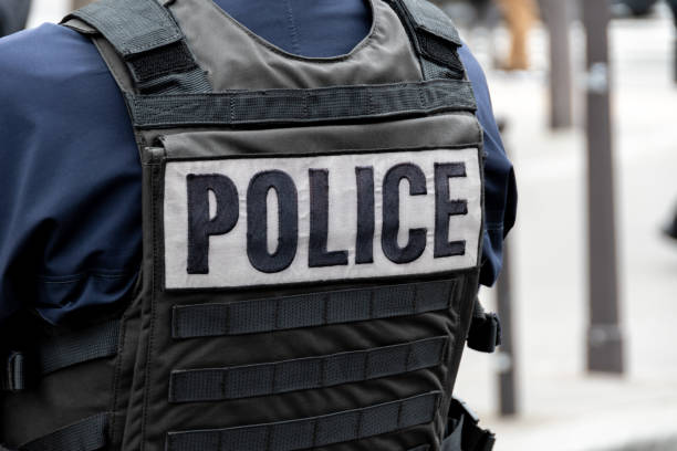 'police' spelt on the back of an officers vest